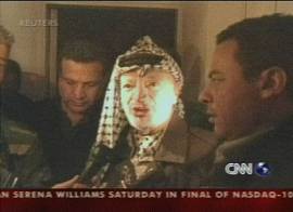 Yasser Arafat sitiado no seu quartel-general em Ramallah,. Imagem: TV CNN em ingl�s, 30/3/2002